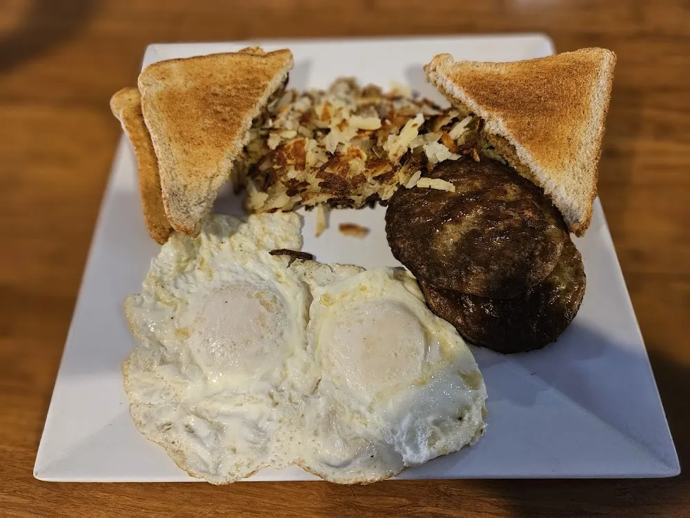 2eggs over Medium Sausage Patties Hashbrowns Toast
